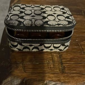 Very cool pill case:) Coach